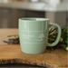 Green groove mug on wooden surface with blurred background